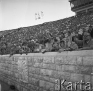 31.07.1955 - 4.08.1955, Warszawa, Polska.
V Światowy Festiwal Młodzieży i Studentów o Pokój i Przyjaźń. Na trybunach Stadionu X-lecia siedzą: trzeci od prawej - premier PRL Józef Cyrankiewicz oraz obok niego I sekretarz KC PZPR Bolesław Bierut.
Fot. Irena Jarosińska, zbiory Ośrodka KARTA