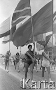 22.07.1959, Warszawa, Polska. 
Uroczyste obchody piętnastolecia PRL, defilada sportowo-wojskowa, młodzież w strojach sportowych ze sztandarami.
Fot. Romuald Broniarek/KARTA